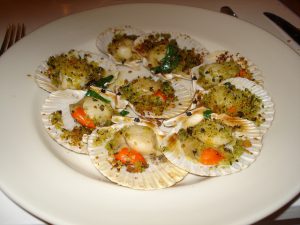 Herb-baked Manx Queenies with Wild Garlic Butter at Hix Oyster and Fish House, Lyme Regis Photo by: Peter Smith CC BY 2.0