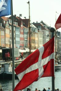 Flag of Denmark in front of Nyhavn, Copenhagen, Denmark Photo by: Niels Bosboom CC BY-SA 3.0